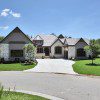 Modern suburban house with green lawn